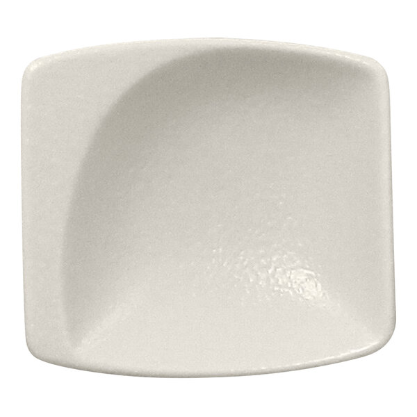 A white square shaped bowl with a curved edge.