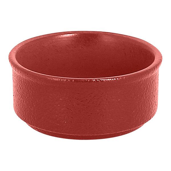 A close up of a RAK Porcelain Magma Dark Red ramekin.