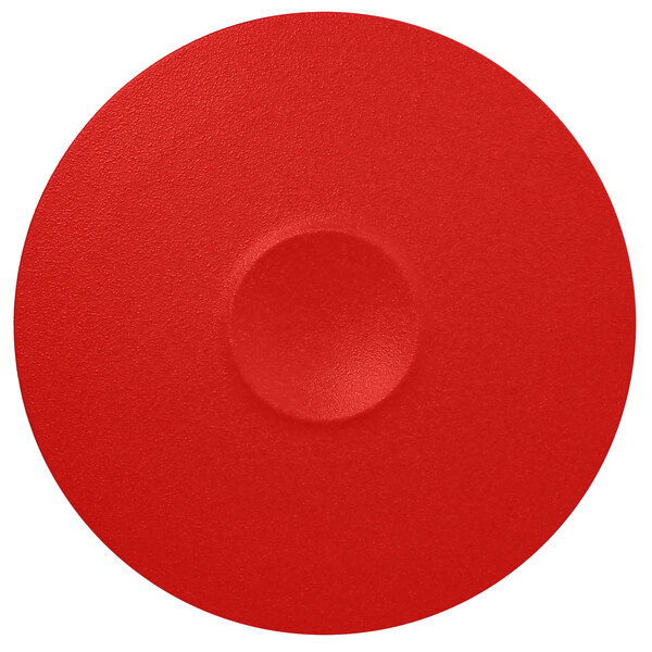 A white porcelain plate with a red circle in the middle.