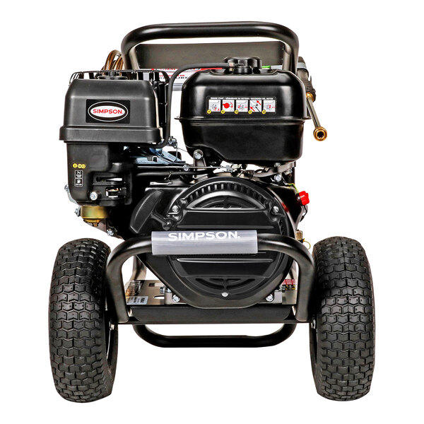 A black Simpson Powershot gas powered pressure washer with white labels and wheels.