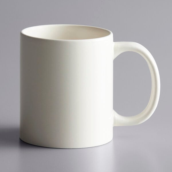 An ivory stoneware mug with a C-handle.