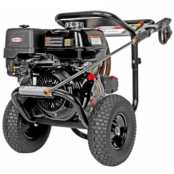 A Simpson gas powered black pressure washer with a Honda engine and wheels with a 50' hose.