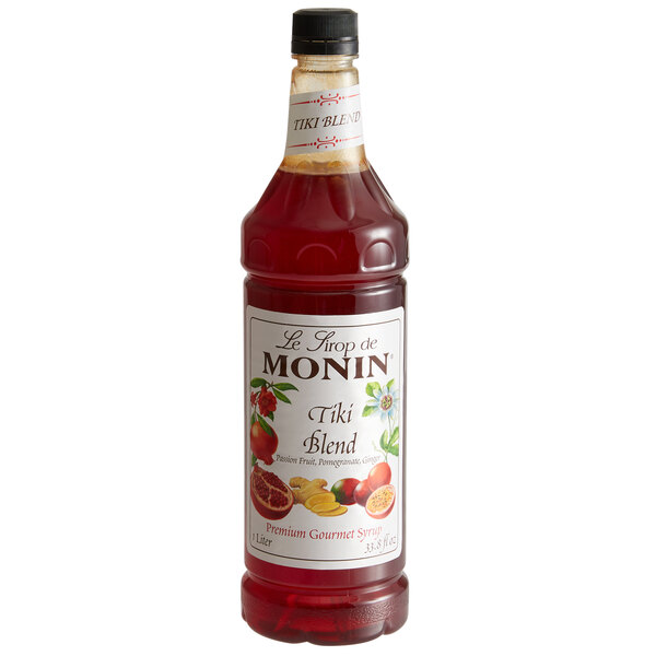 A Monin Premium Tiki Blend Flavoring Syrup 1 Liter bottle with a label.