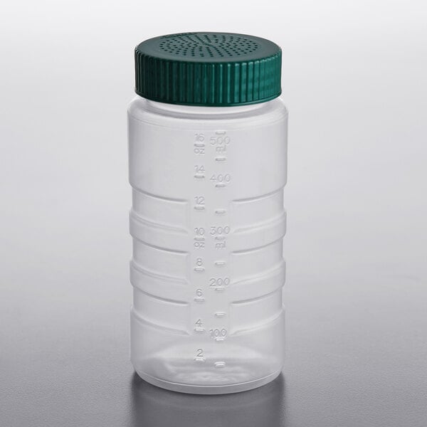 a green plastic cap with holes