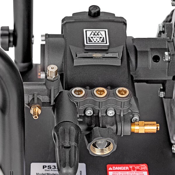 A close-up of a Simpson Powershot pressure washer with a hose.