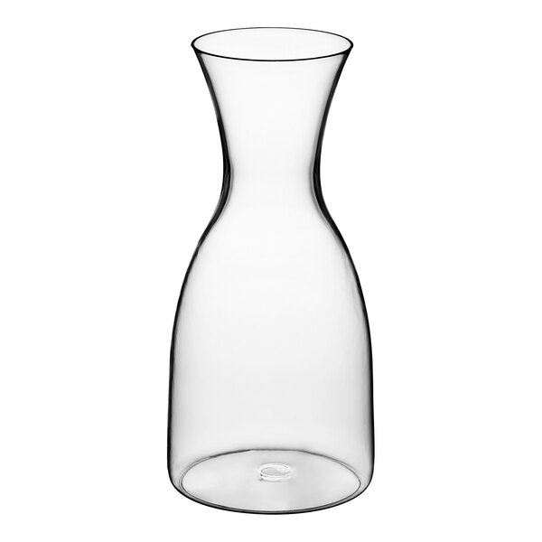 A clear Libbey Tritan plastic carafe with a small amount of liquid in it.