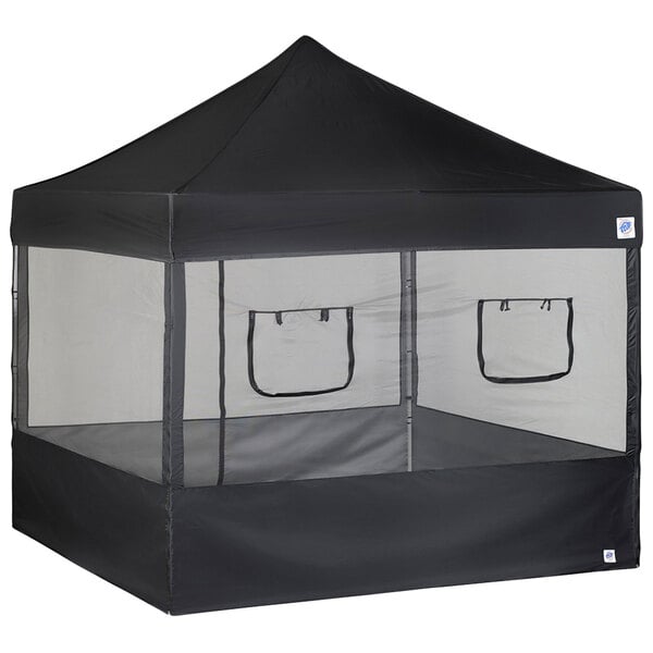 A black E-Z Up food booth tent with mesh panels.