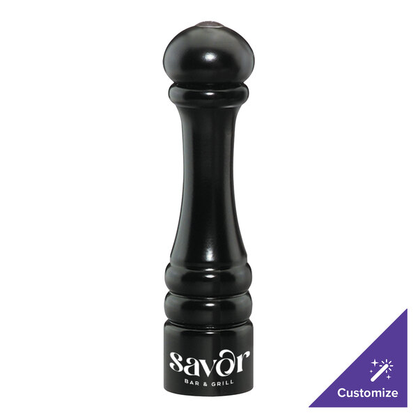 A black salt or pepper shaker with white text that says "Savor" on it.