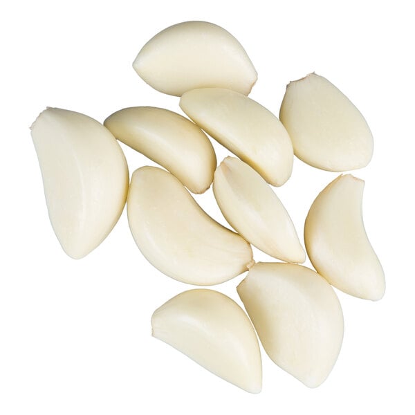 A group of peeled garlic cloves arranged on a white background.