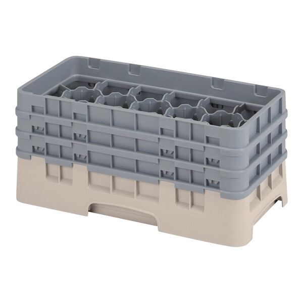 A grey plastic Cambro glass rack with 17 compartments and extenders.