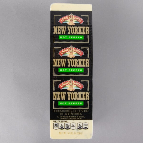 A package of Land O Lakes New Yorker Hot Pepper American Cheese solid blocks with a black label with gold text.