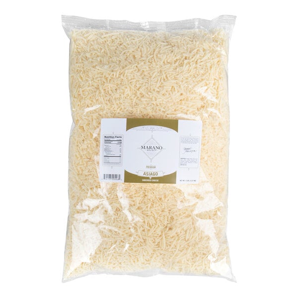 A large clear plastic bag filled with shredded Asiago cheese.
