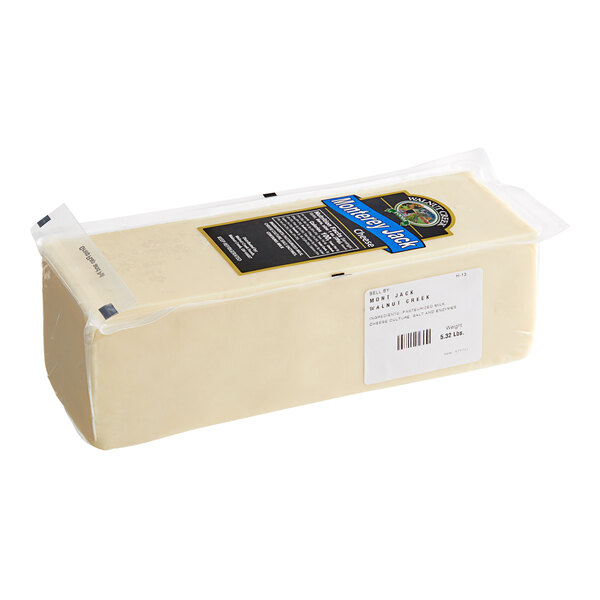 A package of two blocks of Monterey Jack cheese in plastic bags on a white background.