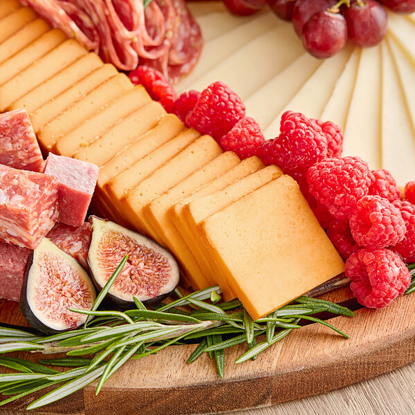 A platter of Great Lakes smoked cheddar cheese and meat with figs.