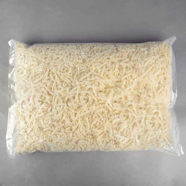 A Great Lakes Cheese 5 lb. bag of shredded Pepper Jack cheese.