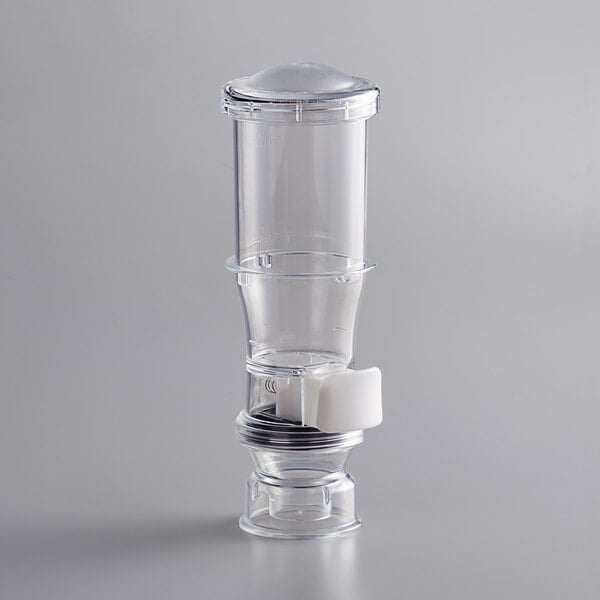 a clear glass with a white handle