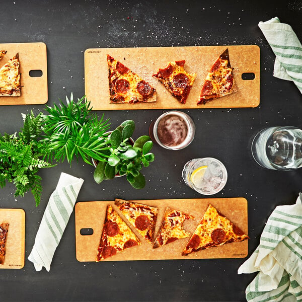 A slice of pepperoni pizza on a wooden bread serving board.