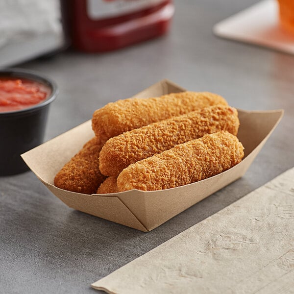 A Bagcraft EcoCraft paper food tray with fried food and red sauce.