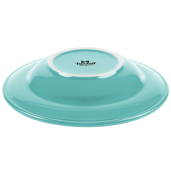 A blue bowl with a white rim.