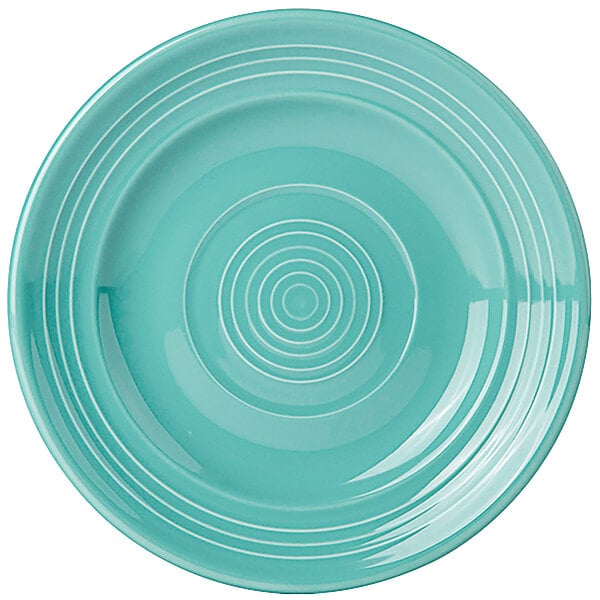 A blue Tuxton Concentrix China plate with a spiral pattern.