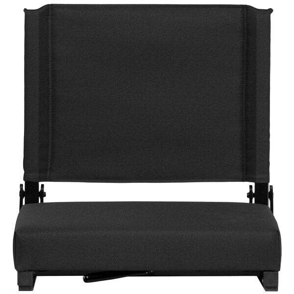 A black stadium seat with a black cushion.