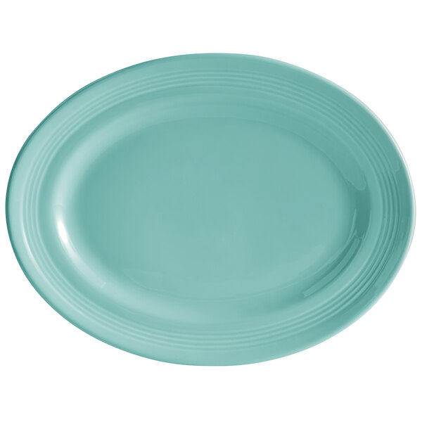 A blue oval Tuxton china platter with a turquoise rim.