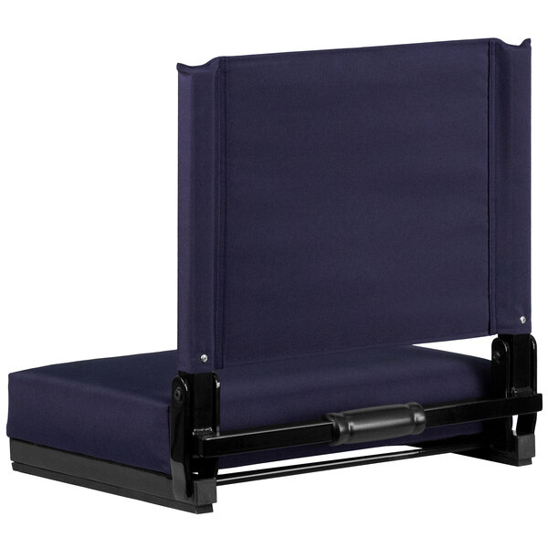 A navy blue Flash Furniture Grandstand comfort seat with a black frame.