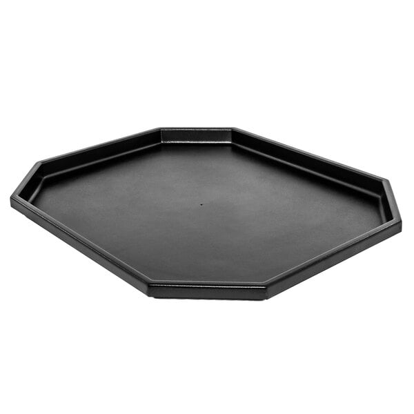 A black octagon-shaped plastic liner for a Marco Company orchard bin.