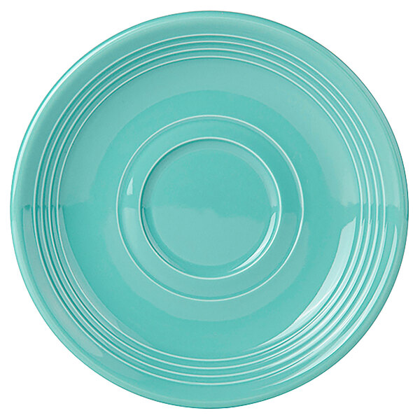 A Tuxton Concentrix Island Blue saucer with a circular pattern and a rim.