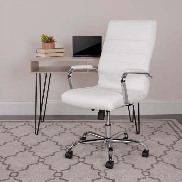 A Flash Furniture white leather swivel office chair with chrome legs next to a desk.