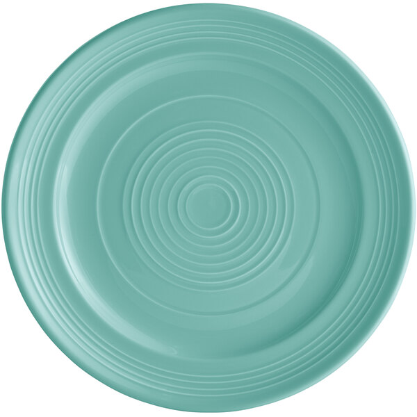 A blue Tuxton Concentrix plate with a spiral pattern.