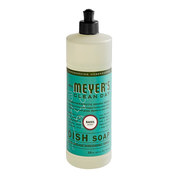 A bottle of Mrs. Meyer's Basil Scented dish soap on a counter.