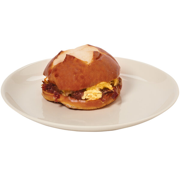 A sandwich on a white Manila melamine round coupe dinner plate.