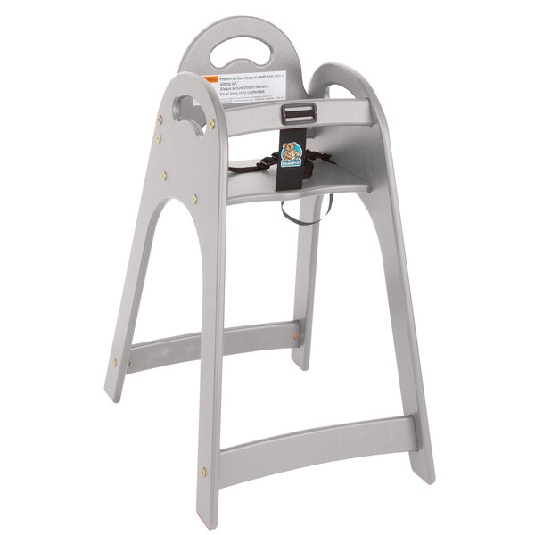 A grey Koala Kare high chair with a tray and seat strap.