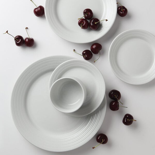 A close-up of a Tuxton Pacifica bright white embossed china plate.