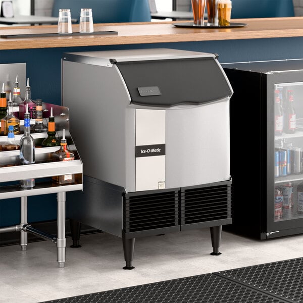 An undercounter air-cooled ice machine with a built-in storage bin, designed for commercial use.