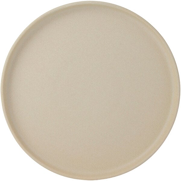 A Tuxton TuxTrendz Zion Matte Beige china plate with a round rim.