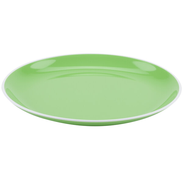 An apple green melamine dinner plate with a white rim.