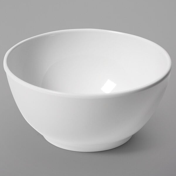 A white bowl on a gray surface.