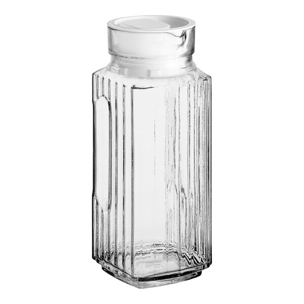 An Anchor Hocking Bistro pitcher with a white lid.