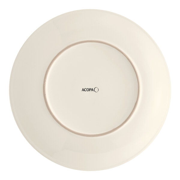 An Acopa ivory stoneware plate with a black circle in the middle.
