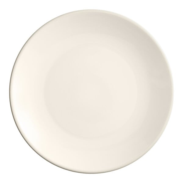 An Acopa ivory stoneware plate with a plain edge and a white rim.