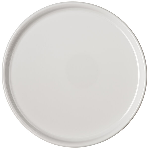 A white plate with a round rim.