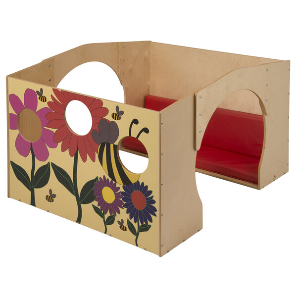 A Whitney Brothers wooden reading haven with flowers and bees painted on it.
