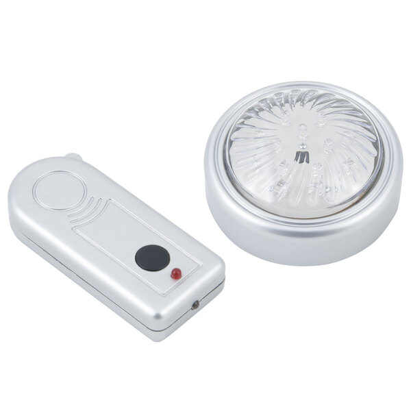 A silver Bon Chef Single Dome Round LED Light with a remote control.