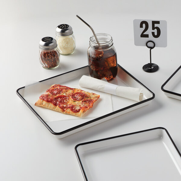 A rectangular black rimmed melamine tray with a square pizza on it and a glass of soda.