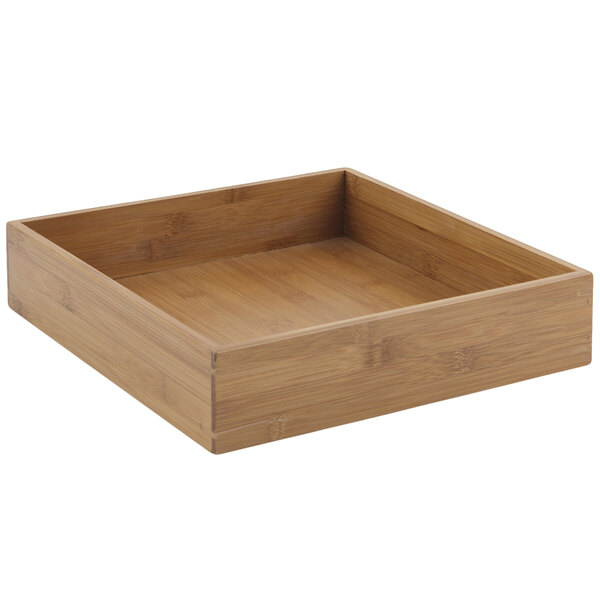 A square wooden underliner for a Bon Chef cold wave platter.