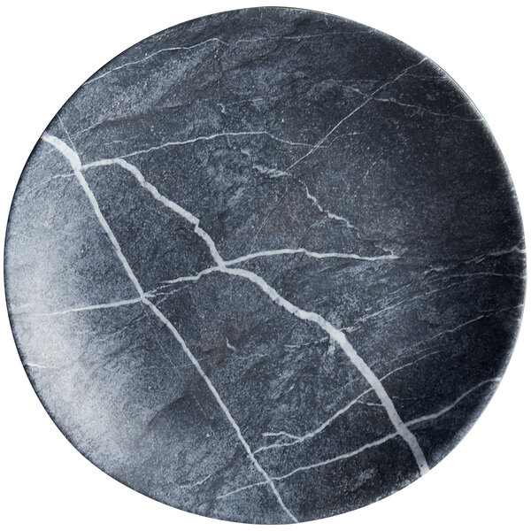 A black and white Carlisle melamine salad plate with a crack.