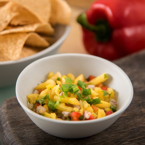 A Carlisle Ridge melamine bowl of salsa with tortilla chips.