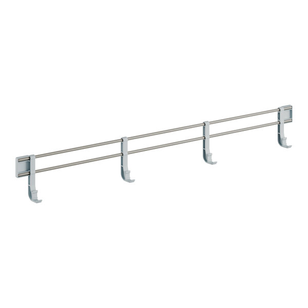A white metal side rail with four hooks on it.